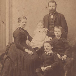 Studio portrait of man, woman and three children.
