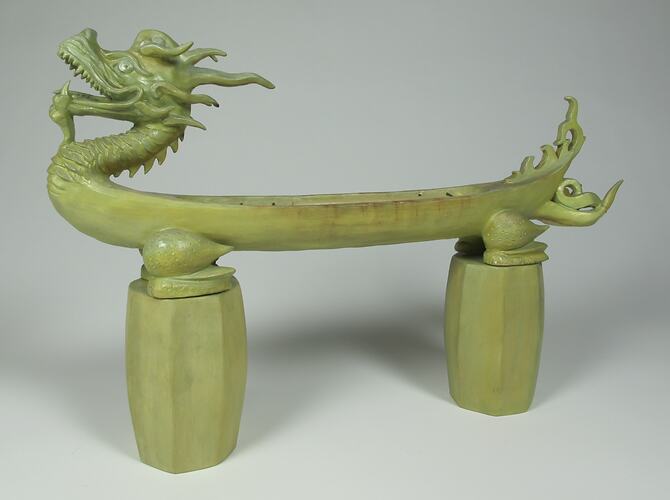 Green stone dragon, side view.