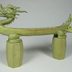 Green stone dragon, side view.