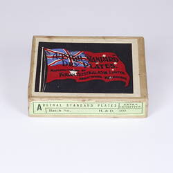 Card box with black, red, blue printing on label lid of flag similar in style not colour to Australian flag.
