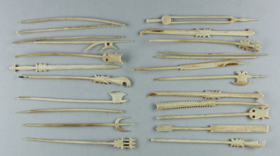 Carved ivory miniature weapons.