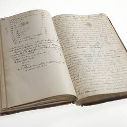 Open book with two pages of handwritten cursive text in ink.