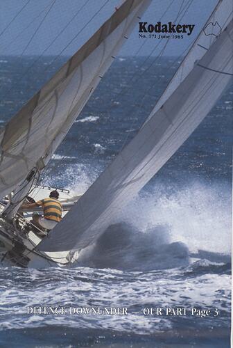 Cover page of yacht sailing in rough waters.