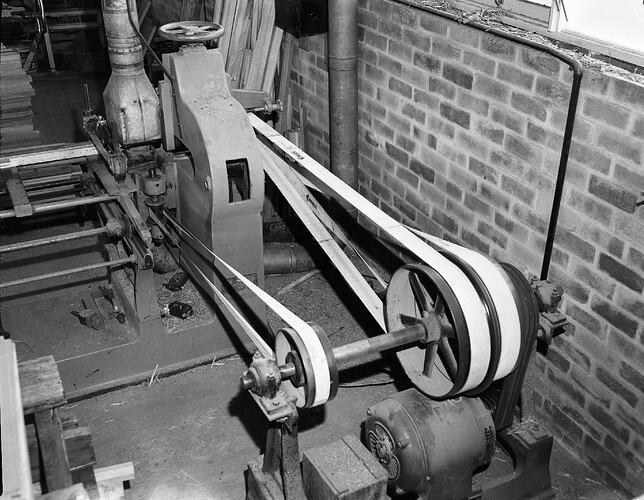 Monochrome photograph of a hoisery factory.
