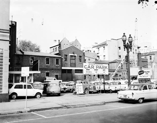 Monochrome image of a city car park.