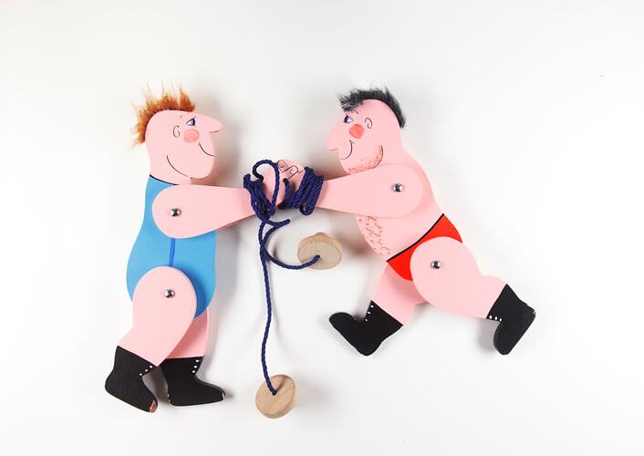 Pair of toy wrestlers with jointed limbs.