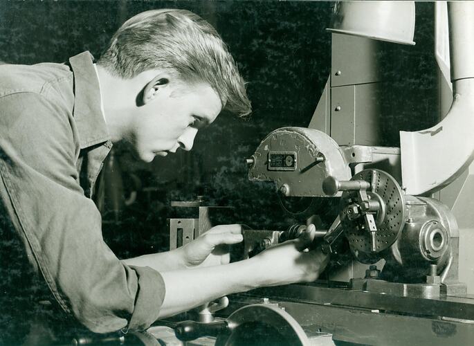 Man using a grinding machine.