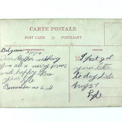 Hand-written back of postcard.