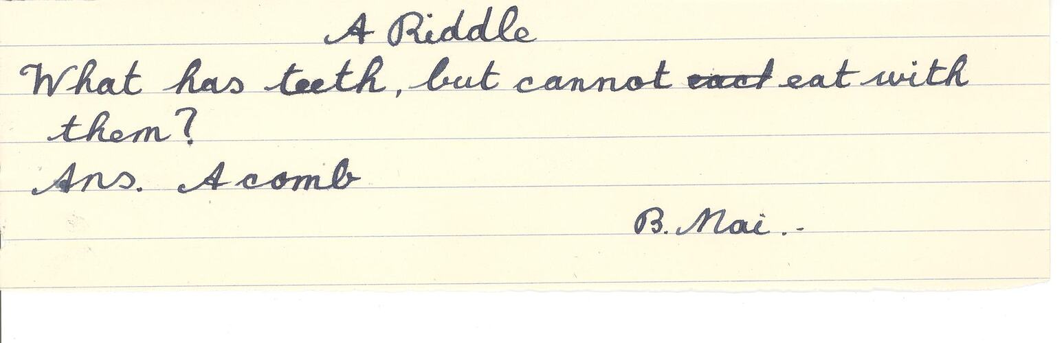 Handwritten annotation in blue ink on lined paper