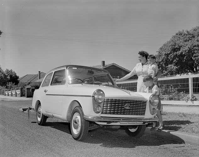 Woman & Children Standing Next to a Motor Car, Glenhuntly, Victoria, 08 Feb 1960