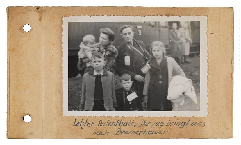Lischke family standing in front of a train in Bremerhaven, November 1955