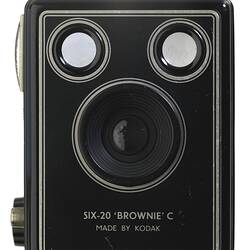 Black box-shaped camera, central lens, two circles at top.