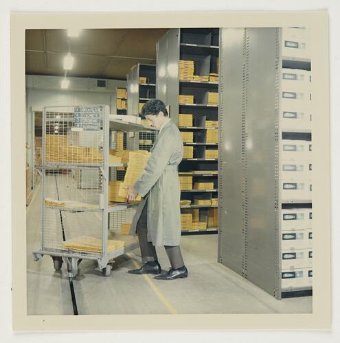 Slide 209, 'Extra Prints of Coburg Lecture', Worker Loading Trolley, Distribution Centre, Kodak Factory, Coburg, circa 1960s