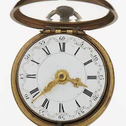 Pocket watch, white dial with Roman and Arabic numerals separated by scalloped circle. Ornate gilt hands.