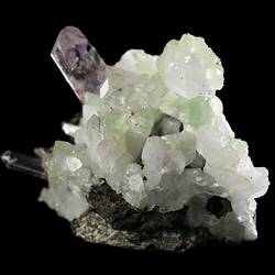 Tall purple crystal with smaller blocky green crystals.