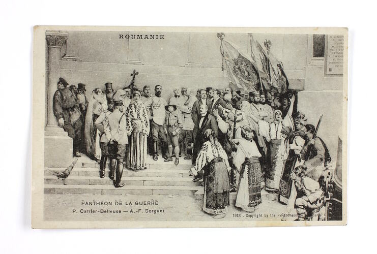 Front of postcard showing people in Roumanian clothing on steps.