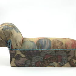Toy chaise longue, side view.