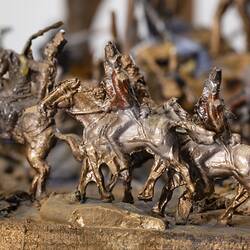 Detail of soldier figurines on horseback. Part of a larger model representing soldiers and miners fighting.