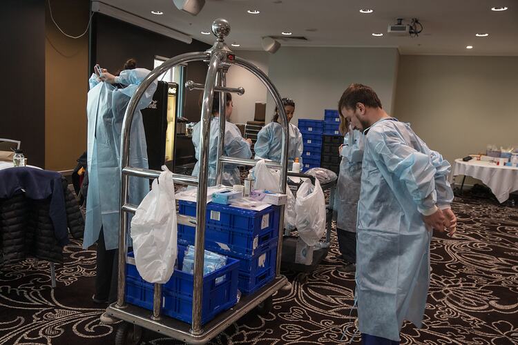 Medical Staff getting dressed in PPE, Novotel, Melbourne, 14 May 2020