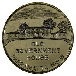 Round medal with Government House and garden.