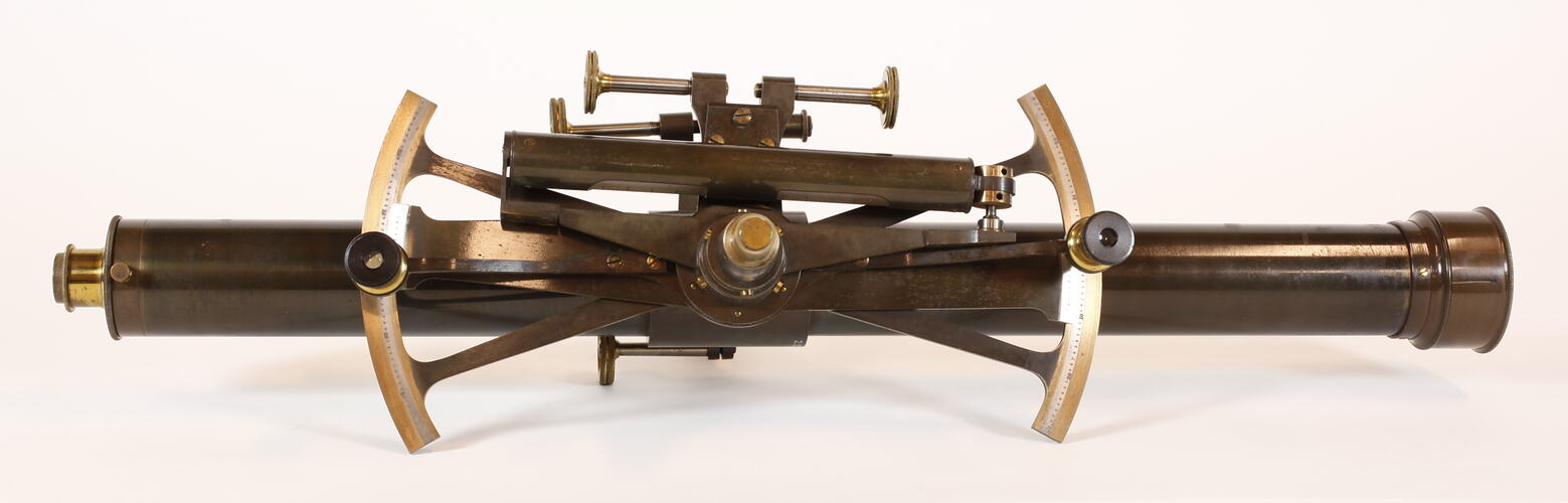 Metal instrument with long cylinder.