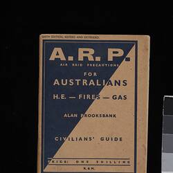 Book front cover. Diagonal split, black background and white text at left,  white with black at right.