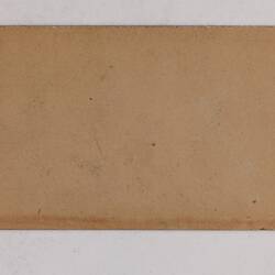 Retangular brown card.