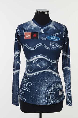 Women's AFLW guernsey with Indigenous pattern in navy and white. Lined and dotted design.