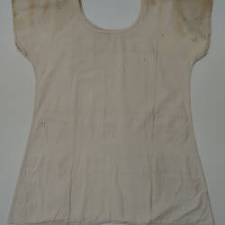 Back of short sleeve white dress. Stained.