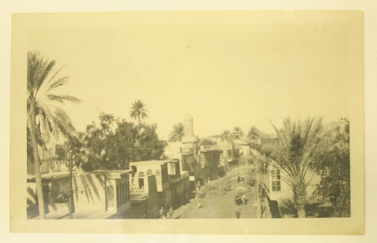 Elevated view of a street in a Middle Eastern village.