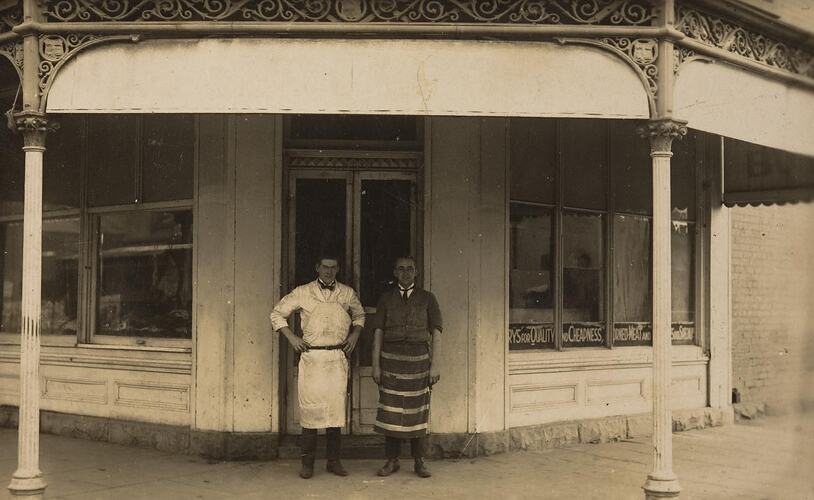 Digital Photograph - Owner & Assistant outside Doolans Butcher Shop, Fitzroy, circa 1925