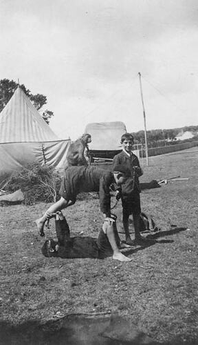 Digital Photograph - Holden Brothers Circus, Two Boys Balancing with Monkey & Another Boy Looking on, 1900-1910