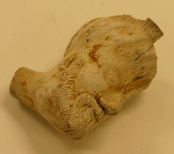 Clay pipe in the shape of a man's head.