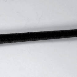 Brown swagger stick.