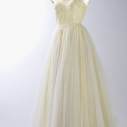 Full length cream evening gown, yellow sequins.