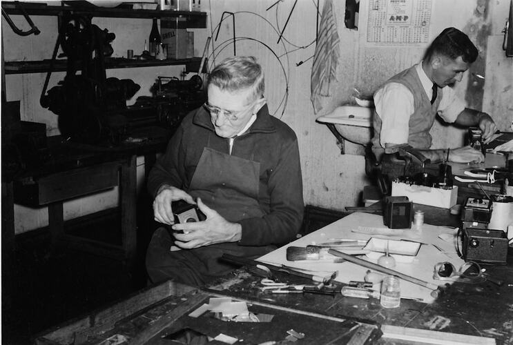 Two camera repairmen working at the Abbotsford Kodak factory.