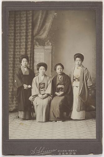 Four women posing on traditional Japanese dress.