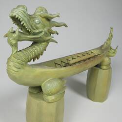 Green stone dragon, three quarter view.