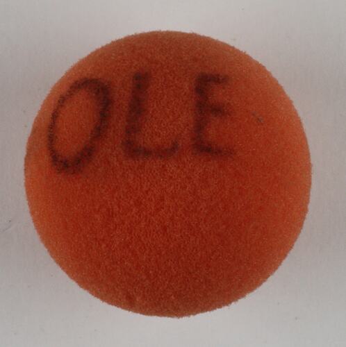 Red sponge ball with Ole written on it.
