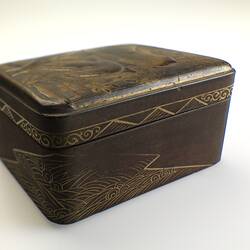 Small box, rounded edges, ornate gold decoration