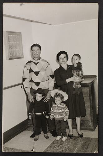 Portrait of family aboard the ship Patris