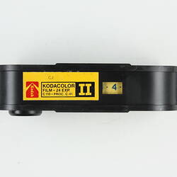 Plastic film cartridge with 'Kodacolor' sticker.