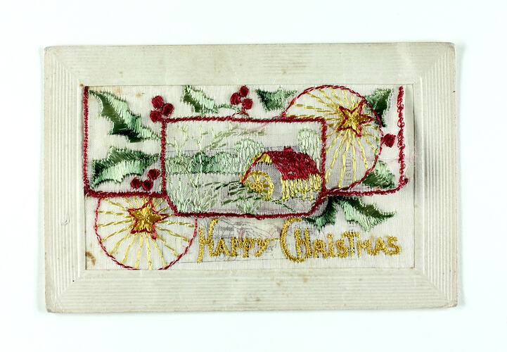 Front of embroidered postcard with Christmas scene.