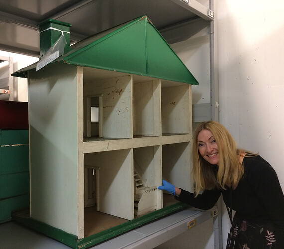 Doll's house in storage with curator.
