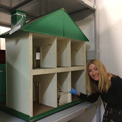 Doll's house in storage with curator.