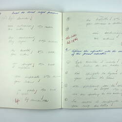 Inside pages of exercise book with hand-writing.