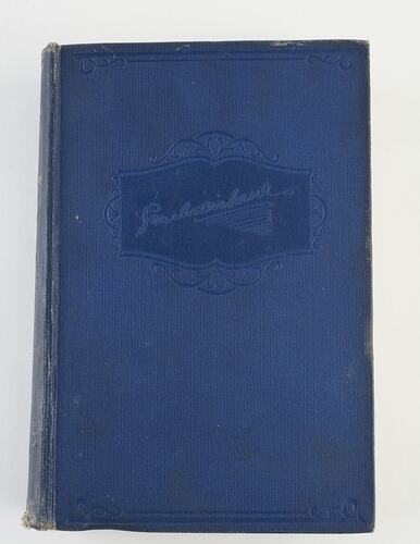 Blue book with embossed lettering.