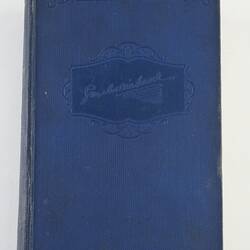 Blue book with embossed lettering.