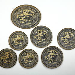 Seven  patterned paper plates.