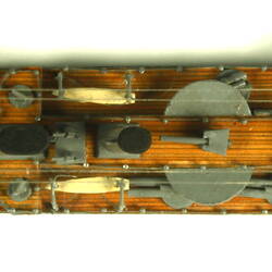 Naval ship with mast, overhead view.